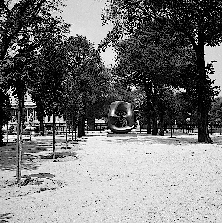 Black-and-white photograph of a Henry Moore sculpture, "Oval with Points," in the Jardin des Tuileries, Paris