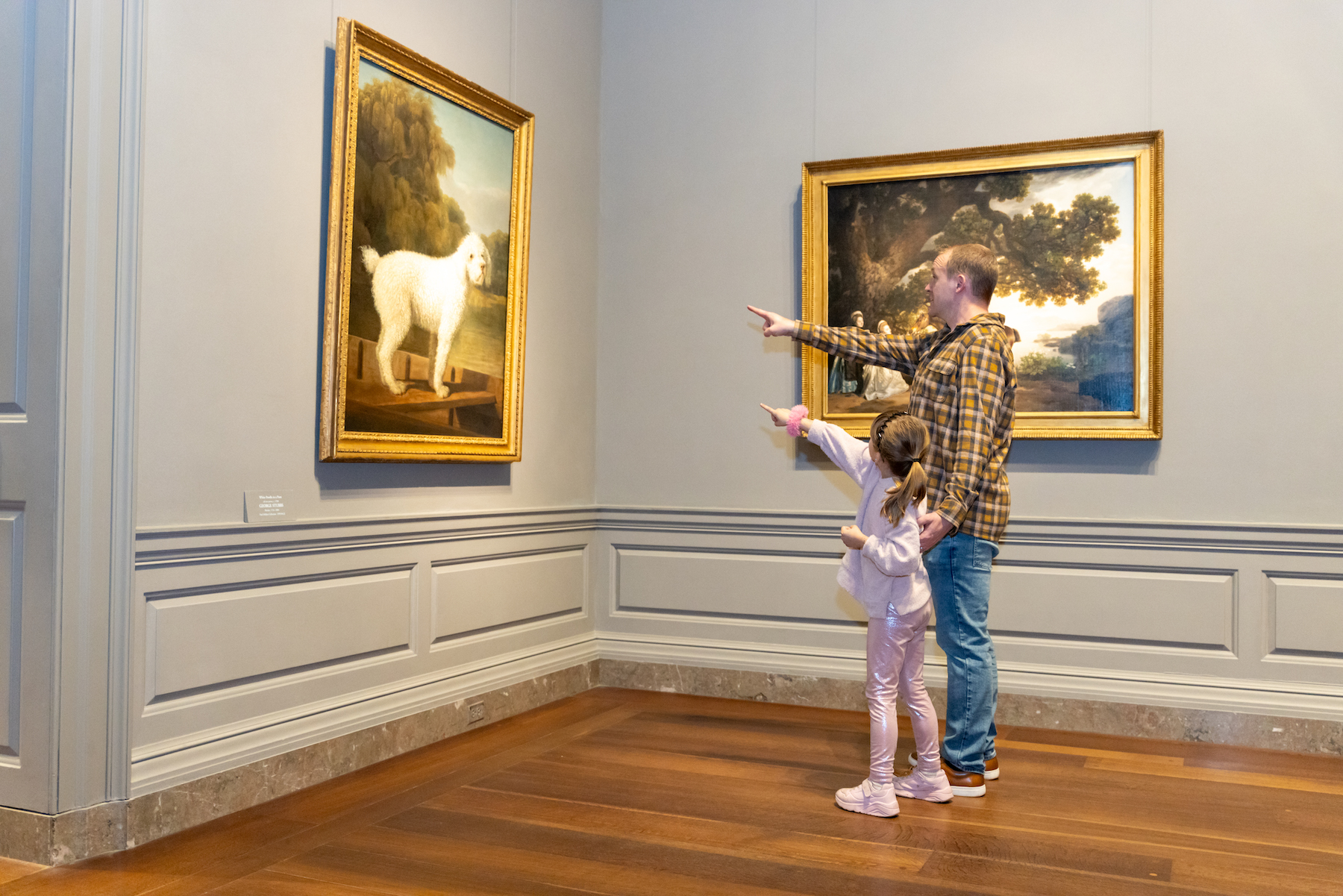 Addy and Austin Graff look at George Stubb's White Poodle in a Punt together