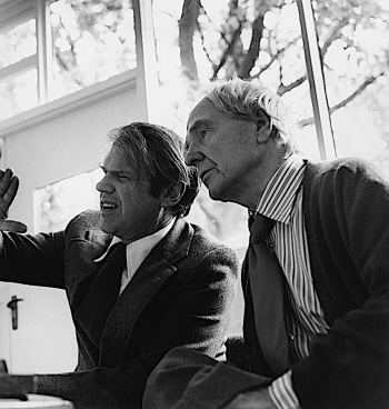Black-and-white photograph of David Finn (left) and Henry Moore choosing the photographs for the book "Henry Moore: Sculpture and Environment"