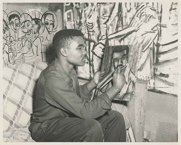 David Driskell painting in his studio