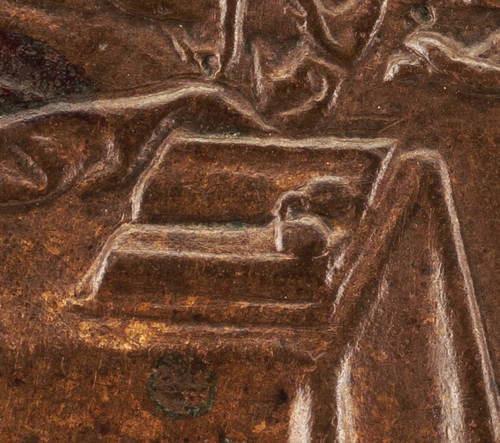 Croppd detail of book on table between two men in the engraving