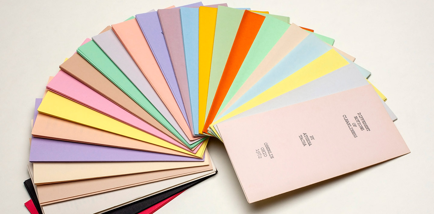 Multi-colored pocket booklets laid out in a semi-circle pattern
