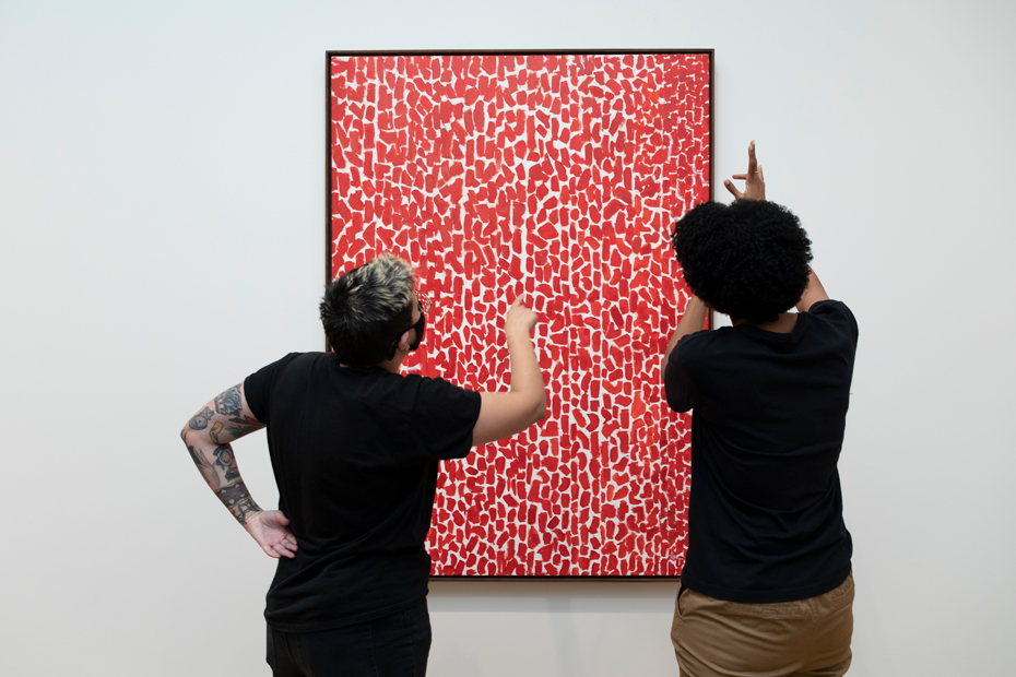 Visitors engage with Alma Thomas's "Red Rose Cantata"