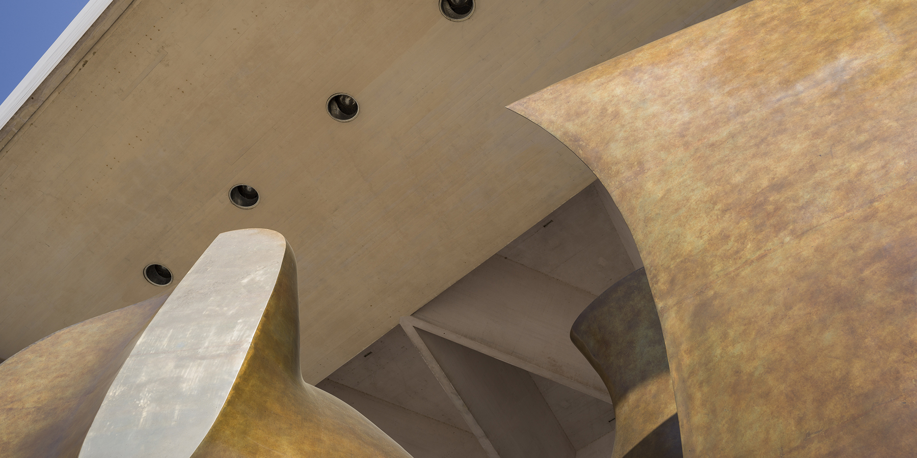 Looking up of a detail of a sculpture by Henry Moore outside the East Building