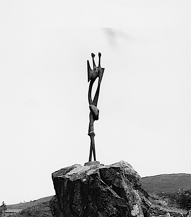 Black-and-white photograph of a Henry Moore sculpture, "Standing Figure," in the Glenkiln Sculpture Park, Scotland