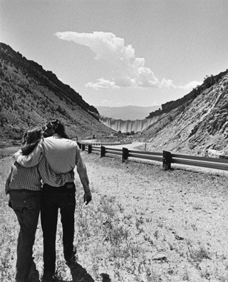 Christo and Jeanne-Claude with the finished project 'Valley Curtain, Rifle, Colorado', 1970-72, August 10, 1972, gelatin silver print, Shunk-Kender Photography Collection, Department of Image Collections, National Gallery of Art Library, Gift of the Roy Lichtenstein Foundation in memory of Harry Shunk and János Kender. © Christo. Photograph: Shunk-Kender © J. Paul Getty Trust. All Rights Reserved.