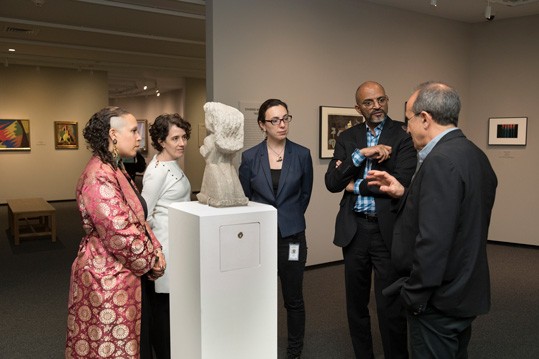 CASVA members Rachel Grace Newman, Annie G. Miller, Megan Driscoll, and Steven Nelson with Harry Cooper, Curator and Head of Modern and Contemporary Art, discussing William Edmondson's "Schoolteacher" (1935, limestone, National Gallery of Art, Washington, Corcoran Collection [Gift of David and Renee McKee], 2015.19.3920).