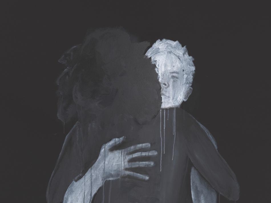 Two people hugging.