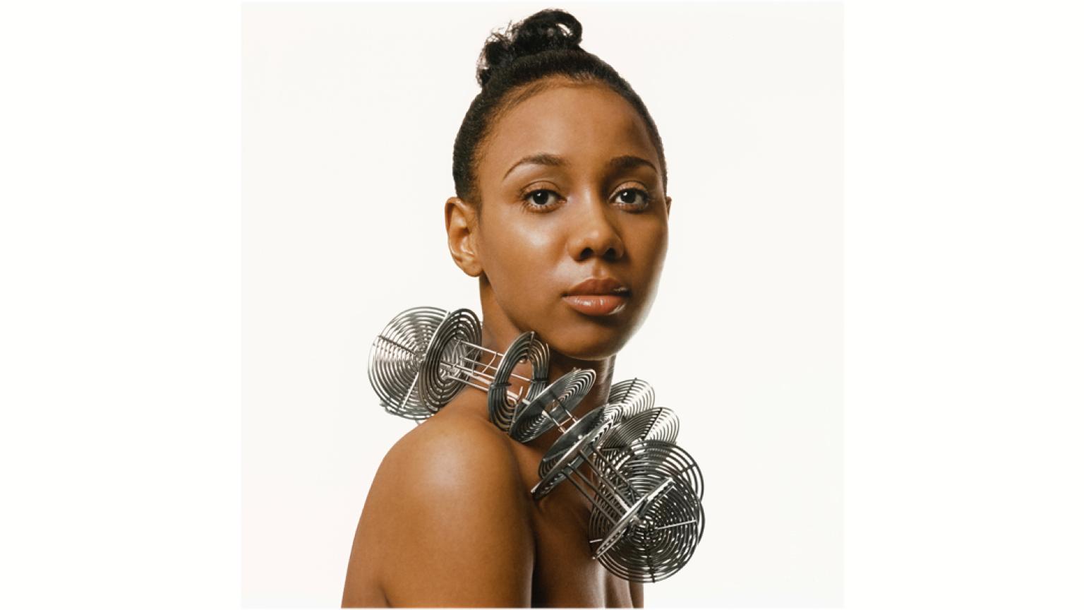 Kwame Brathwaite's photograph of a young woman, Untitled (Portrait, Reels as Necklace), c. 1972