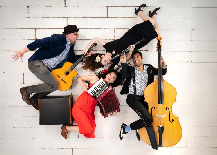 A band posing with their instruments.