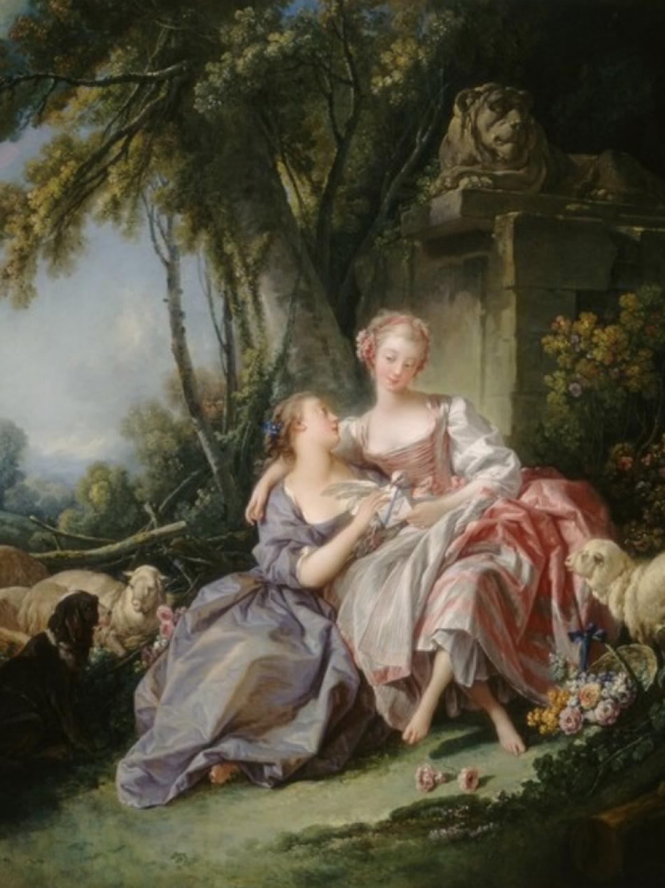 There are two women in extravegant dress. One sits in the lap of the other. They are outdoors and surrounded by sheep. 