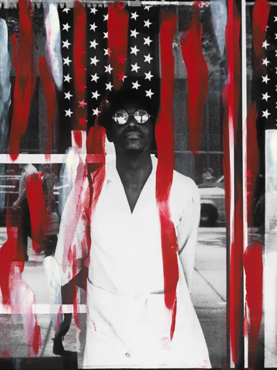 This photographs shows a black woman standing in front of American flags. There are red streaks of paint on top of the photograph.