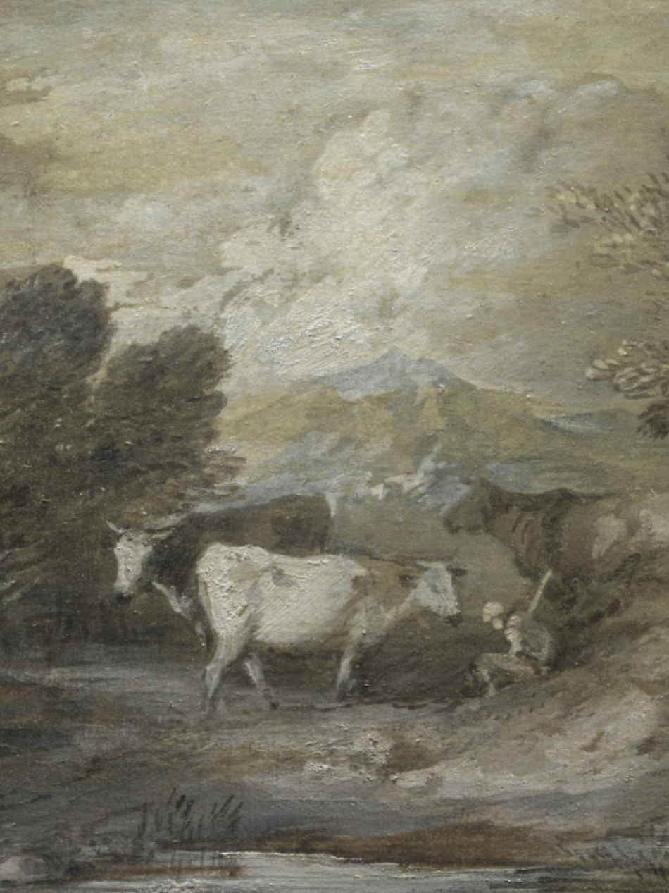 Two cows wander in the landscape